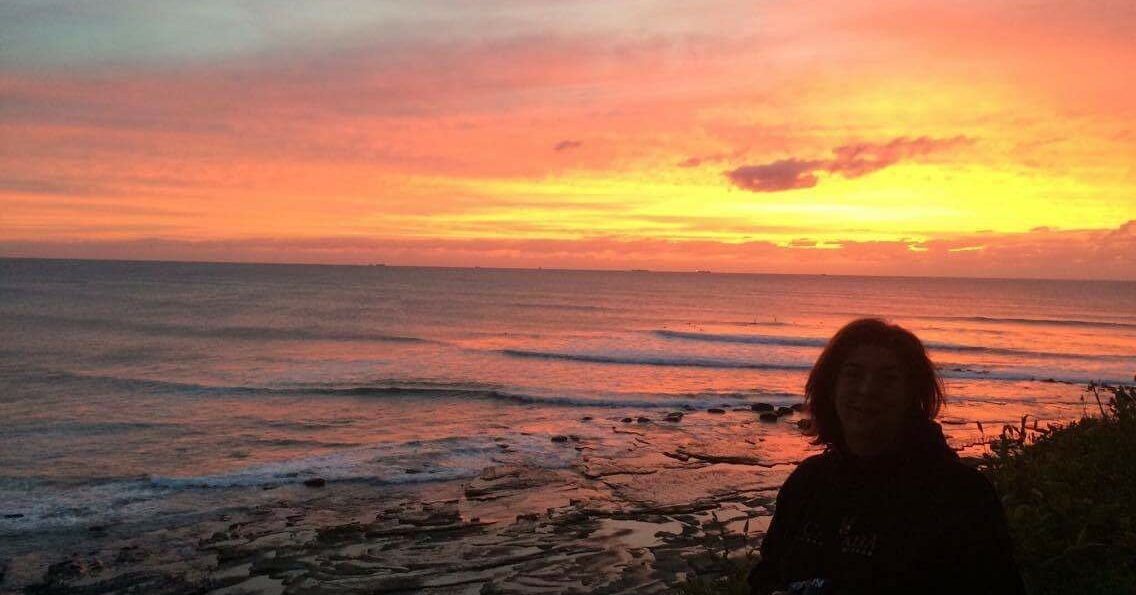 Terese contemplating life in the sunset